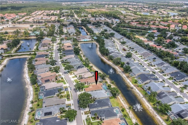 8074 Tauren Ct, Naples, FL 34119 - bird's eye view featuring a residential view and a water view