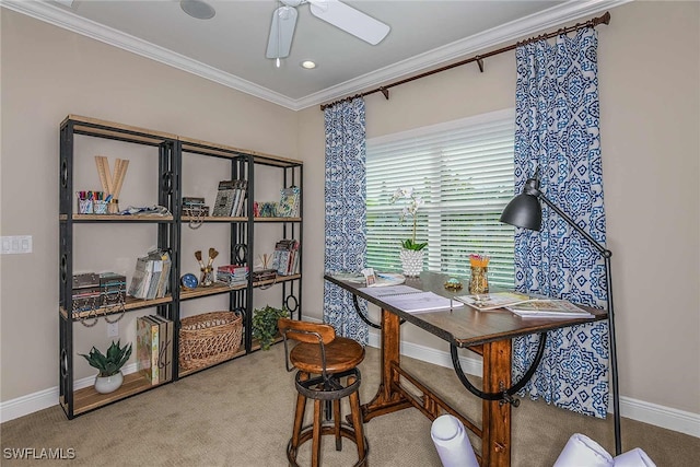 carpeted office space featuring ornamental molding, a ceiling fan, and baseboards