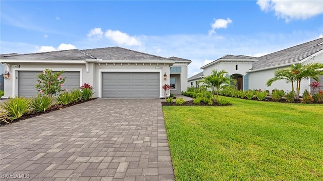 4640 Skysail Dr, Naples, FL 34120 - view of front facade with an attached garage, a front yard, decorative driveway, and stucco siding