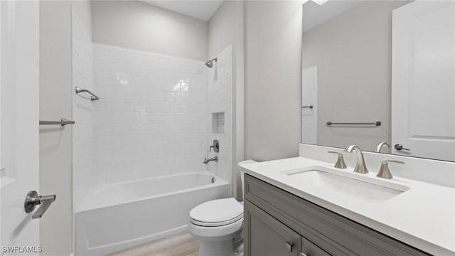 4640 Skysail Dr, Naples, FL 34120 - full bathroom with vanity, toilet, bathtub / shower combination, and wood finished floors