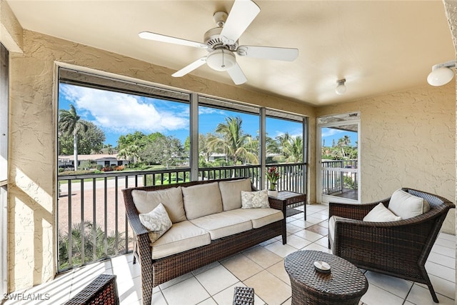 sunroom / solarium featuring ceiling fan