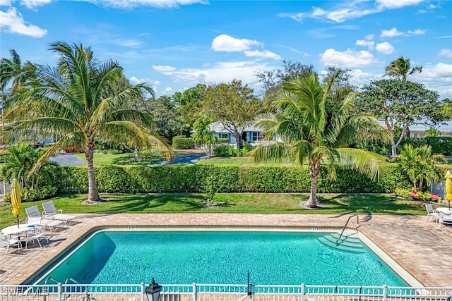 view of pool with a patio, fence, and a fenced in pool