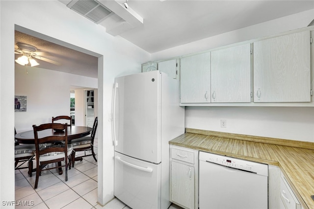 kitchen with white appliances, light countertops, visible vents, and light tile patterned floors