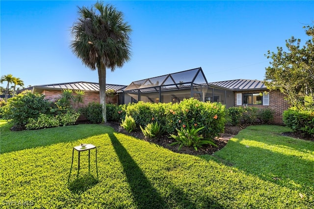 view of yard with a lanai