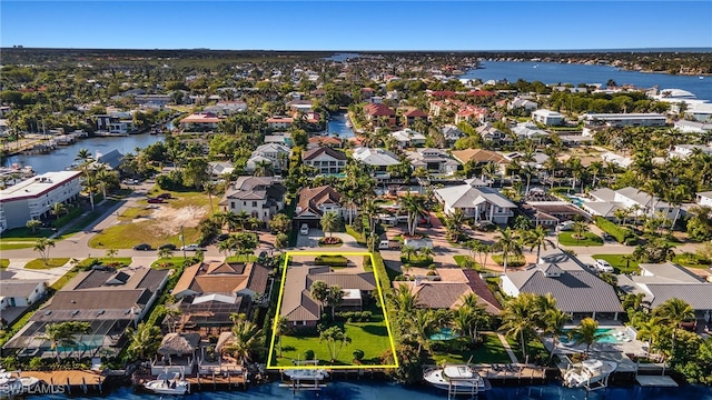 bird's eye view with a residential view and a water view