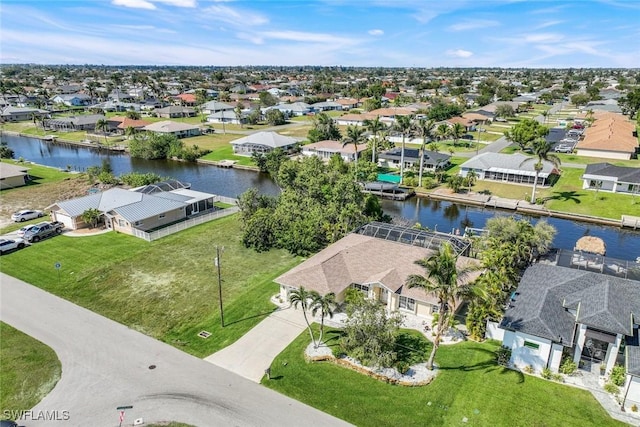 aerial view featuring a residential view and a water view