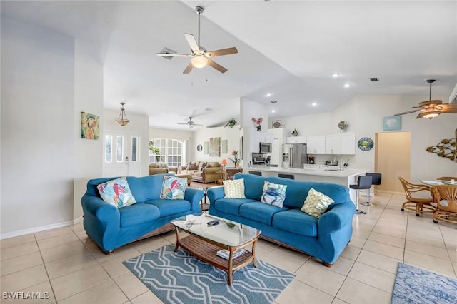 living area with light tile patterned floors, visible vents, baseboards, a ceiling fan, and lofted ceiling