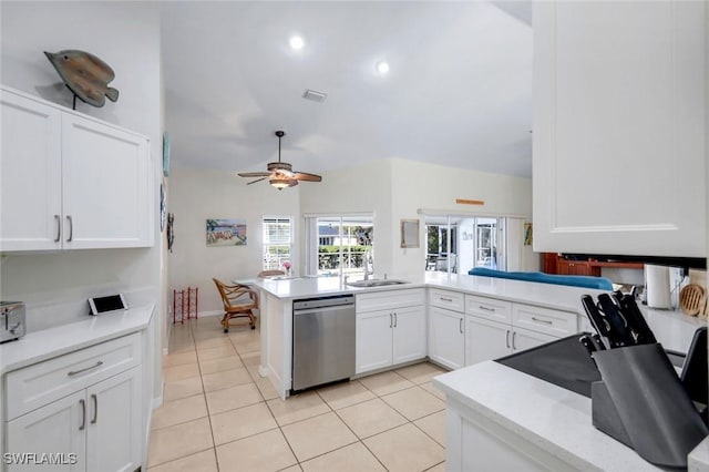 kitchen with light tile patterned floors, a sink, visible vents, white cabinetry, and dishwasher