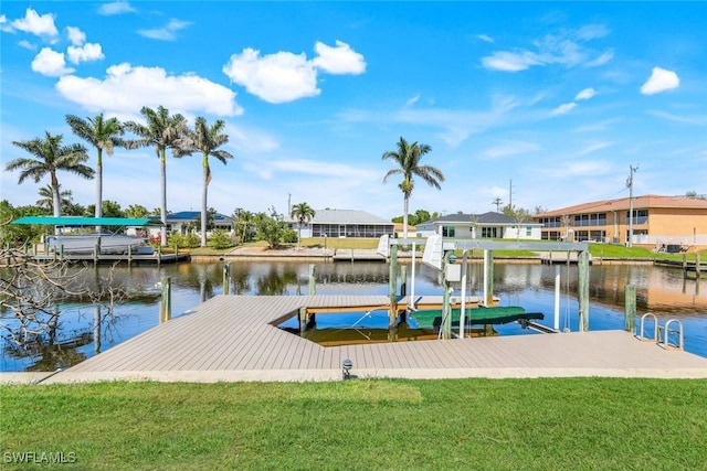 dock area with a residential view, a water view, a lawn, and boat lift