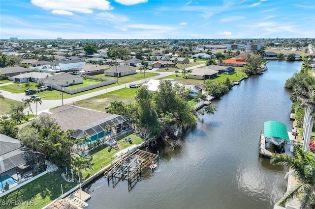 aerial view with a water view and a residential view