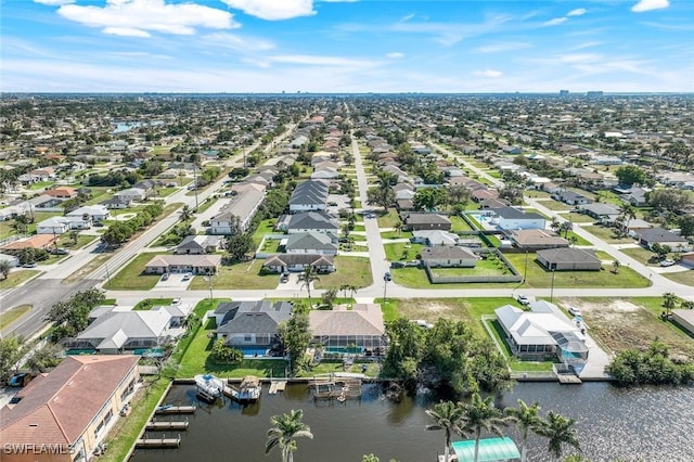 bird's eye view featuring a residential view and a water view