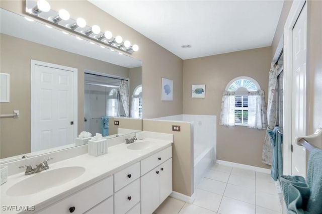 bathroom with a stall shower, a sink, a bath, and tile patterned floors