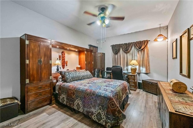 bedroom featuring light wood-type flooring and a ceiling fan