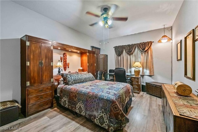 2725 SW 28th Pl, Cape Coral, FL 33914 - bedroom with light wood-style flooring and ceiling fan