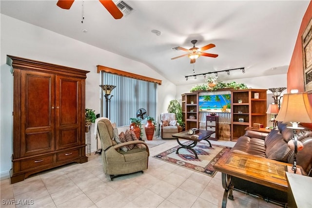 living area with lofted ceiling, light tile patterned flooring, visible vents, and ceiling fan