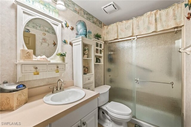 2725 SW 28th Pl, Cape Coral, FL 33914 - bathroom with a shower stall, toilet, wallpapered walls, and vanity