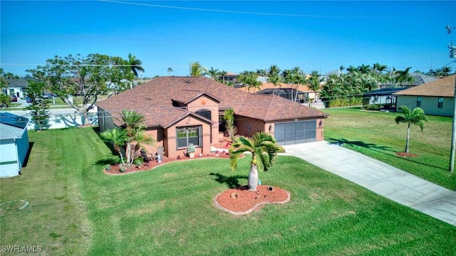 single story home featuring a front yard, a garage, driveway, and stucco siding