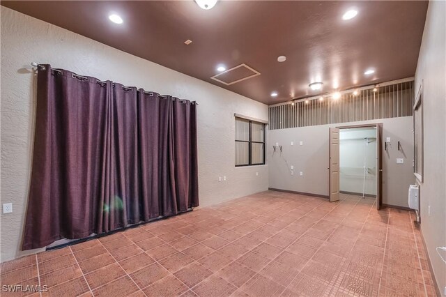 2725 SW 28th Pl, Cape Coral, FL 33914 - spare room featuring attic access and recessed lighting
