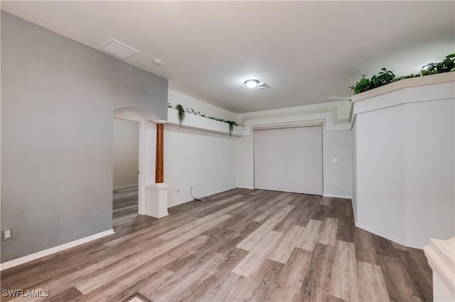2725 SW 28th Pl, Cape Coral, FL 33914 - finished basement with wood finished floors, arched walkways, and baseboards