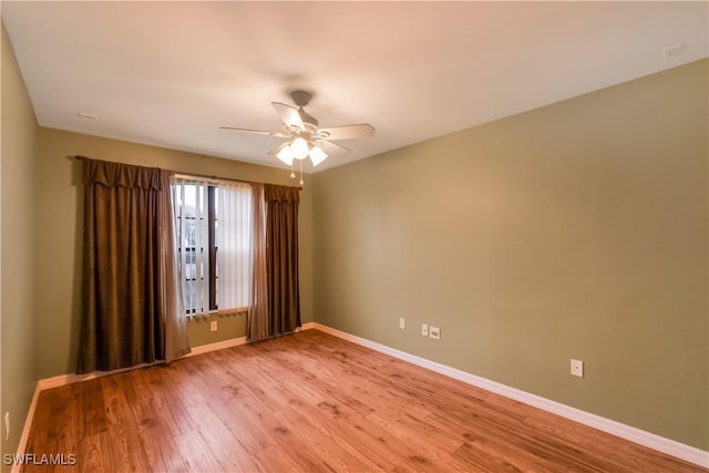 2725 SW 28th Pl, Cape Coral, FL 33914 - spare room featuring ceiling fan, baseboards, and light wood-style floors