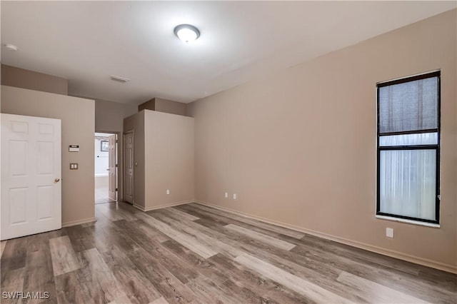 2725 SW 28th Pl, Cape Coral, FL 33914 - empty room with wood finished floors and baseboards