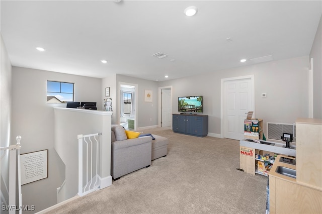 carpeted living room with recessed lighting, visible vents, and baseboards