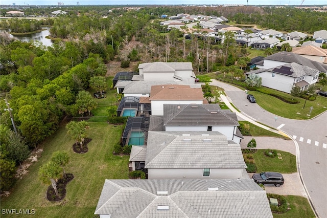 aerial view with a residential view and a water view