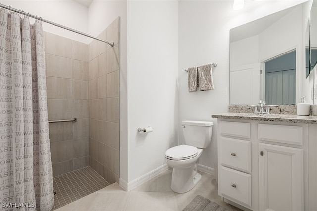 full bathroom with tiled shower, toilet, vanity, and tile patterned flooring