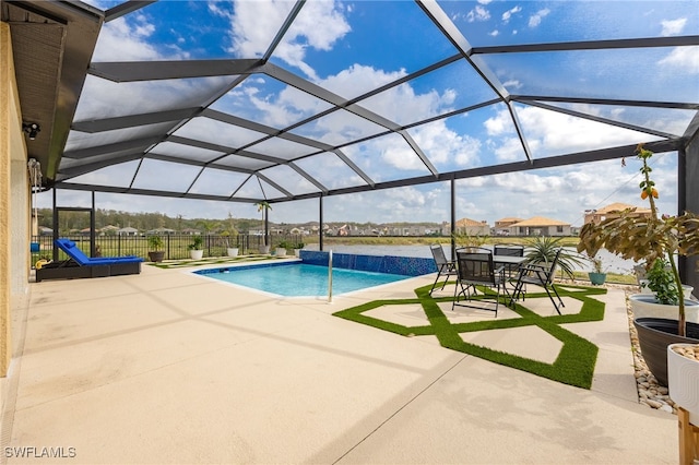 pool with a patio, a lanai, and fence