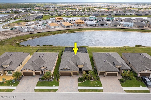 aerial view featuring a residential view and a water view