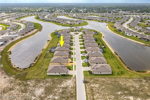 aerial view featuring a residential view and a water view