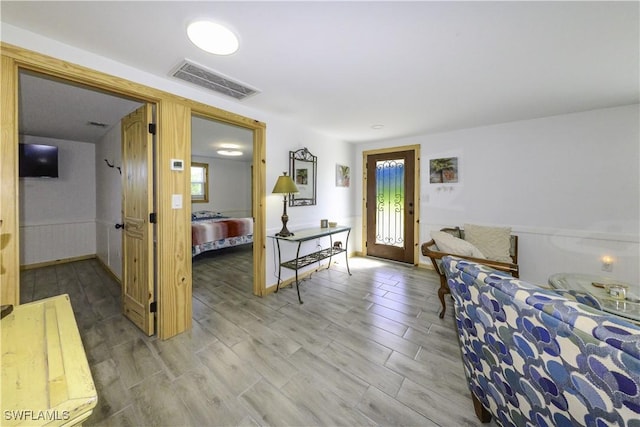 living room with visible vents and wood finished floors