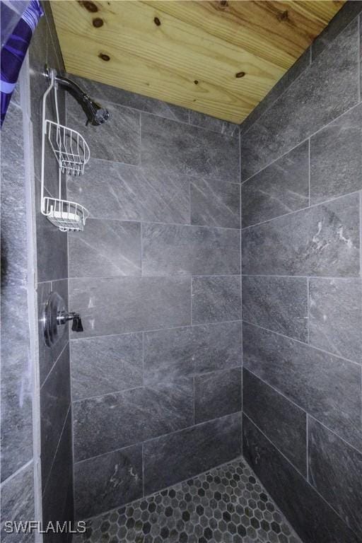 full bath featuring tiled shower