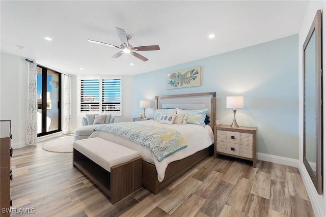 bedroom with baseboards, light wood-type flooring, a ceiling fan, and recessed lighting