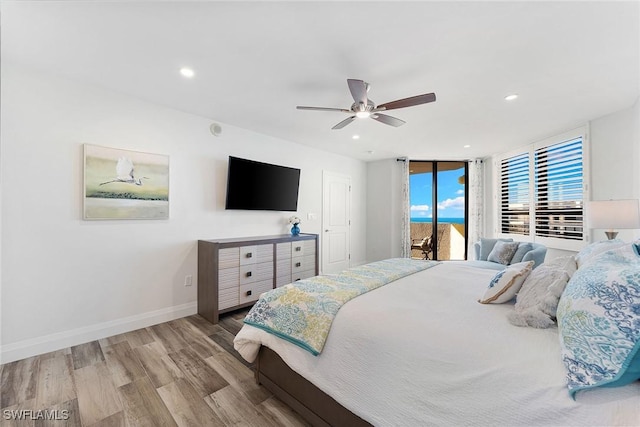 bedroom with baseboards, a ceiling fan, wood finished floors, access to outside, and recessed lighting