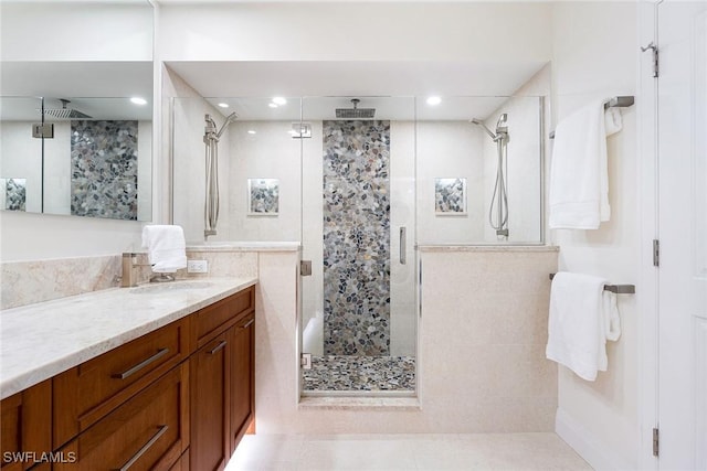 bathroom featuring a stall shower, tile patterned flooring, vanity, and recessed lighting