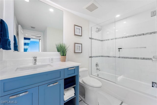 full bathroom with toilet, visible vents, combined bath / shower with glass door, and vanity