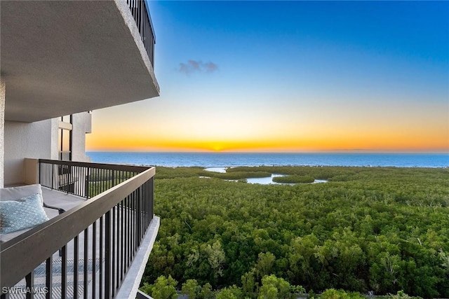 balcony at dusk with a water view