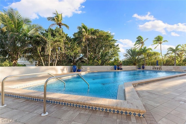 community pool featuring a patio area