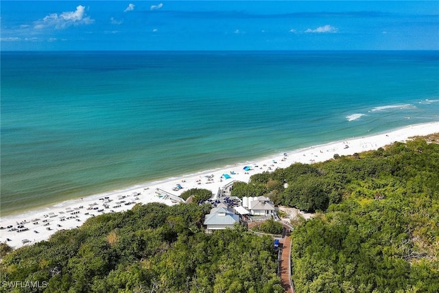 birds eye view of property with a view of the beach and a water view