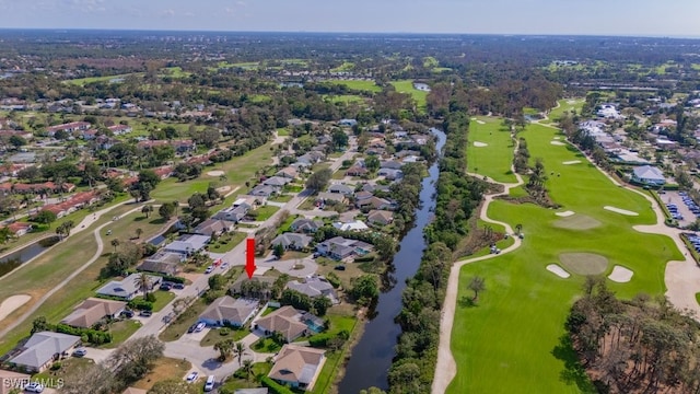 birds eye view of property with a residential view and golf course view