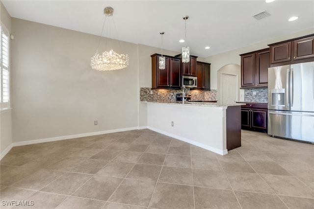 kitchen featuring appliances with stainless steel finishes, light tile patterned flooring, visible vents, and plenty of natural light