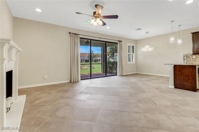 unfurnished living room featuring light tile patterned flooring, recessed lighting, a ceiling fan, and baseboards
