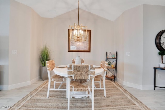 dining space featuring light wood-style floors, lofted ceiling, a notable chandelier, and baseboards