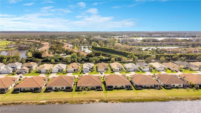 bird's eye view featuring a residential view and a water view