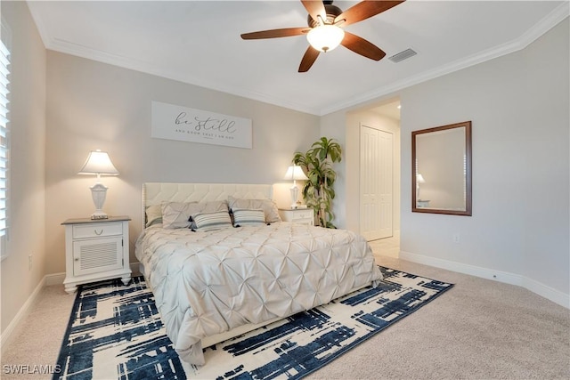 bedroom with ornamental molding, visible vents, and light carpet