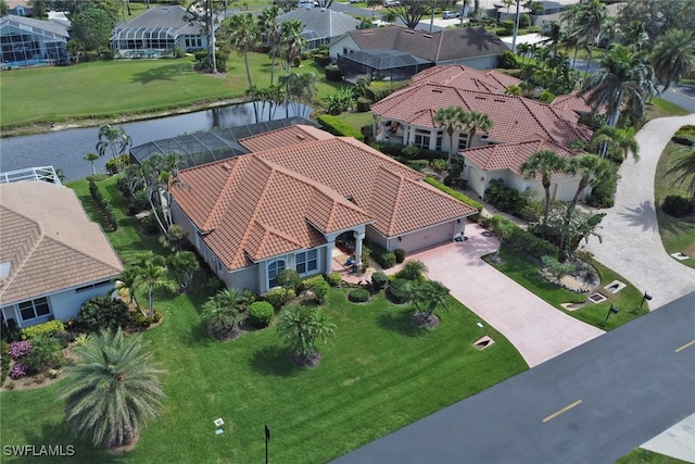 drone / aerial view featuring a water view and a residential view