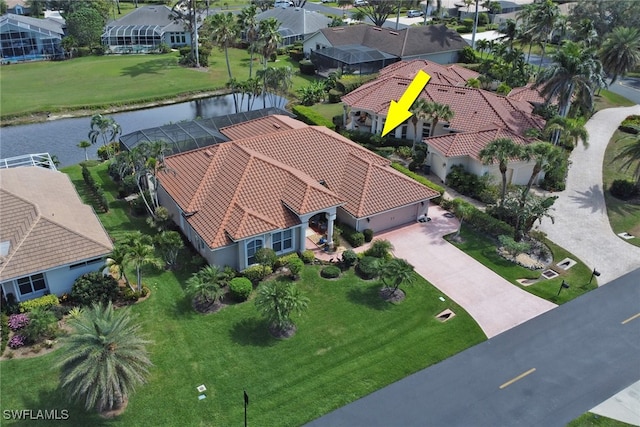 drone / aerial view featuring a water view and a residential view