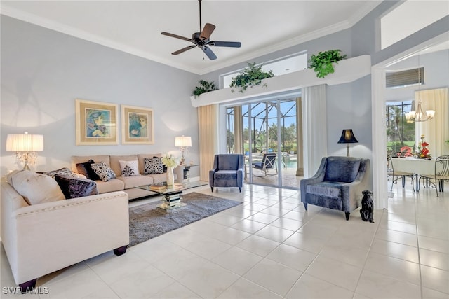 living room featuring crown molding, light tile patterned floors, visible vents, a towering ceiling, and ceiling fan with notable chandelier