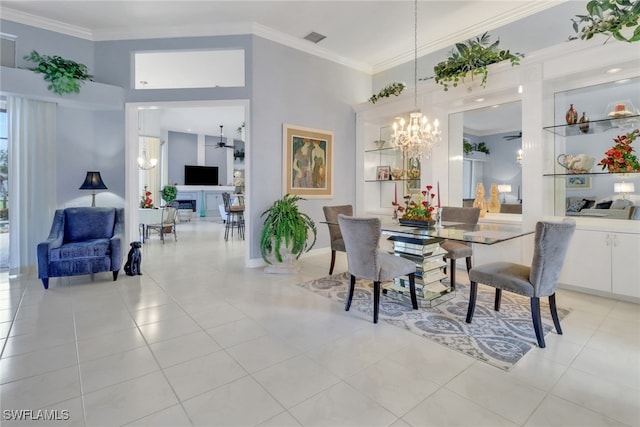 dining space featuring ornamental molding, built in shelves, visible vents, and an inviting chandelier